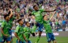 Seattle Sounders' Kelvin Leerdam (18) leaps and pumps his fist after scoring against the Vancouver Whitecaps late in the second half of an MLS soccer match Saturday, June 29, 2019, in Seattle. The Sounders won 1-0. (AP Photo/Elaine Thompson)