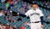 CORRECTS TO THIRD INNING INSTEAD OF SECOND INNING - Seattle Mariners starting pitcher Tommy Milone gets a new ball after giving up a home run to Texas Rangers' Rougned Odor in the third inning of a baseball game Tuesday, July 23, 2019, in Seattle. (AP Photo/Elaine Thompson)
