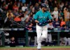 Seattle Mariners' Edwin Encarnacion tosses aside his bat after hitting a three-run home run against the Houston Astros durng the sixth inning of a baseball game Wednesday, June 5, 2019, in Seattle. (AP Photo/Elaine Thompson)