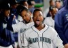 Seattle Mariners' Tim Beckham mugs for photographers from in the dugout after hitting a two-run home run against the Texas Rangers in the sixth inning of a baseball game Thursday, April 25, 2019, in Seattle. (AP Photo/Elaine Thompson)