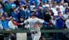 Chicago Cubs' Willson Contreras spreads his arms wide as he heads home on his solo home run against the Seattle Mariners in the fourth inning of a baseball game Wednesday, May 1, 2019, in Seattle. (AP Photo/Elaine Thompson)