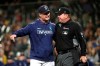 Seattle Mariners manager Scott Servais, left, argues with home plate umpire Sam Holbrook after Servais was ejected from the baseball game against the Houston Astros during the seventh inning Wednesday, Sept. 25, 2019, in Seattle. (AP Photo/Elaine Thompson)