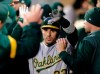 Oakland Athletics' Ramon Laureano makes his way through the dugout after hitting a solo home run on a pitch from Seattle Mariners' Marco Gonzales during the third inning of a baseball game, Saturday, Sept. 28, 2019, in Seattle. (AP Photo/John Froschauer)