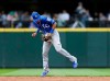 Kansas City Royals shortstop Nicky Lopez blocks a ground ball hit by Seattle Mariners' Daniel Vogelbach, before throwing him out at first during the third inning of a baseball game Wednesday, June 19, 2019, in Seattle. (AP Photo/John Froschauer)