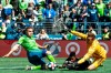 Seattle Sounders forward Jordan Morris tries to score against Los Angeles FC forward Latif Blessing and goalkeeper Tyler Miller in the second half of an MLS soccer game in Seattle, Sunday April 28, 2019. Morris appeared to be clutching his hamstring when he came up from the play. (Bettina Hansen/The Seattle Times via AP)