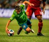 Seattle Sounders' Nicolas Lodeiro is fouled by Real Salt Lake's Nedum Onuoha during the second half of an MLS soccer match Saturday, April 6, 2019, in Seattle. (Dean Rutz/The Seattle Times via AP)
