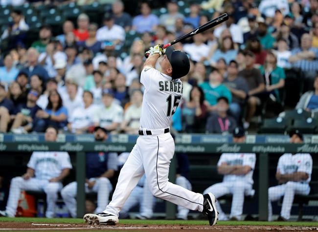 Seattle Mariners' Kyle Seager pops out during the first inning of a baseball game against the Texas Rangers, Monday, May 27, 2019, in Seattle. (AP Photo/Ted S. Warren)