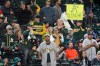 A fan holds a sign that reads 