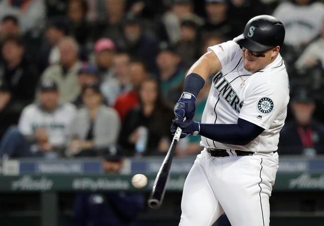 Seattle Mariners' Daniel Vogelbach hits a solo home run during the second inning of the team's baseball game against the Oakland Athletics, Tuesday, May 14, 2019, in Seattle. (AP Photo/Ted S. Warren)