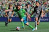 Seattle Sounders forward Nicolas Lodeiro, center, drives the ball away from Minnesota United defender Michael Boxall, right, during the first half of an MLS soccer match, Sunday, Oct. 6, 2019, in Seattle (AP Photo/Ted S. Warren)