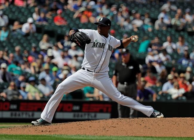 Seattle Mariners closing pitcher Roenis Elias throws against the Texas Rangers during the ninth inning of a baseball game, Wednesday, July 24, 2019, in Seattle. Elias earned the save and the Mariners won 5-3. (AP Photo/Ted S. Warren)