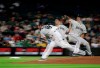 In this multiple-exposure photo, Seattle Mariners starting pitcher Yusei Kikuchi throws against the Oakland Athletics during the sixth inning of a baseball game, Monday, May 13, 2019, in Seattle. (AP Photo/Ted S. Warren)