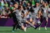 Minnesota United midfielder Kevin Molino, second from left, gets to a ball in front of Seattle Sounders forward Nicolas Lodeiro, left, during the first half of an MLS soccer match, Sunday, Oct. 6, 2019, in Seattle. The Sounders won 1-0. (AP Photo/Ted S. Warren)