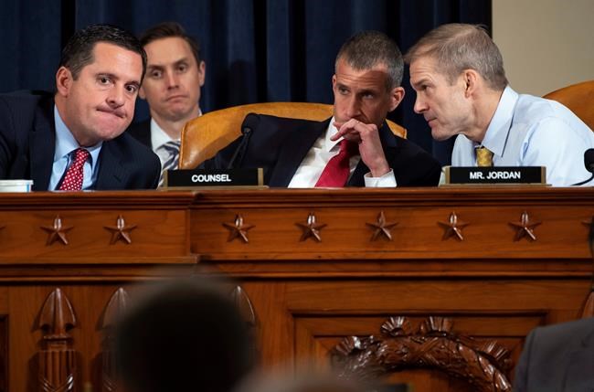Ranking member Rep. Devin Nunes, R-Calif., left, confers with Rep. Jim Jordan, R-Ohio, right, and Steve Castor, Republican staff of the House Oversight Committee, as top U.S. diplomat in Ukraine William Taylor, and career Foreign Service officer George Kent, testify before the House Intelligence Committee on Capitol Hill in Washington, Wednesday, Nov. 13, 2019, during the first public impeachment hearing of President Donald Trump's efforts to tie U.S. aid for Ukraine to investigations of his political opponents. (Saul Loeb/Pool Photo via AP)