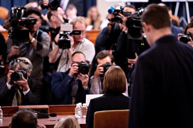 Former White House national security aide Fiona Hill arrives to testify before the House Intelligence Committee on Capitol Hill in Washington, Thursday, Nov. 21, 2019, during a public impeachment hearing of President Donald Trump's efforts to tie U.S. aid for Ukraine to investigations of his political opponents. (Andrew Harrer/Pool Photo via AP)