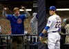 Milwaukee Brewers' Christian Yelich reacts after watching a two-run home run hit by Chicago Cubs' Victor Caratini during the fifth inning of a baseball game Saturday, April 6, 2019, in Milwaukee. (AP Photo/Aaron Gash)