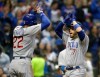 Chicago Cubs' Victor Caratini (7) celebrates with Jason Heyward (22) after hitting a two-run home run during the fifth inning of a baseball game against the Milwaukee Brewers Saturday, April 6, 2019, in Milwaukee. (AP Photo/Aaron Gash)
