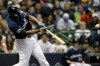 Milwaukee Brewers' Lorenzo Cain hits a solo home run during the third inning of the team's baseball game against the St. Louis Cardinals onTuesday, April 16, 2019, in Milwaukee. (AP Photo/Aaron Gash)
