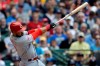 Cincinnati Reds' Eugenio Suarez hits a home run during the third inning of a baseball game against the Milwaukee Brewers, Saturday, June 22, 2019, in Milwaukee. (AP Photo/Aaron Gash)