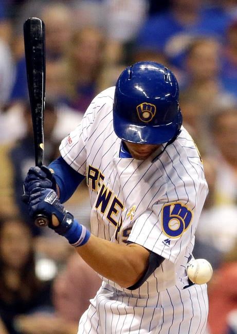 Milwaukee Brewers' Tyrone Taylor is hit by a pitch during the seventh inning of a baseball game against the Chicago Cubs Saturday, Sept. 7, 2019, in Milwaukee. (AP Photo/Aaron Gash)