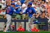Chicago Cubs' Victor Caratini, right, is congratulated by Brian Butterfield after hitting a three-run home run during the sixth inning of a baseball game against the Milwaukee Brewers, Sunday, July 28, 2019, in Milwaukee. (AP Photo/Aaron Gash)