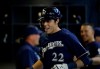 Milwaukee Brewers' Christian Yelich reacts in the dugout after his home run against the St. Louis Cardinals during the first inning of a baseball game Sunday, March 31, 2019, in Milwaukee. (AP Photo/Jeffrey Phelps)