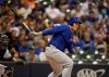 Chicago Cubs' Anthony Rizzo watches his two-run double against the Milwaukee Brewers during the fifth inning of a baseball game Thursday, Sept. 5, 2019, in Milwaukee. (AP Photo/Jeffrey Phelps)