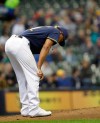 Milwaukee Brewers starting pitcher Freddie Peralta reacts to giving up a home run to the Colorado Rockies' Nolan Arenado during the second inning of a baseball game Thursday, May 2, 2019, in Milwaukee. (AP Photo/Jeffrey Phelps)