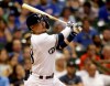 Milwaukee Brewers' Keston Hiura watches his two-run home run during the 10th inning of a baseball game against the Chicago Cubs, Saturday, July 27, 2019, in Milwaukee. (AP Photo/Jeffrey Phelps)