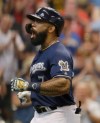 Milwaukee Brewers' Eric Thames reacts after his home run against the Pittsburgh Pirates during the eighth inning of a baseball game Sunday, June 30, 2019, in Milwaukee. (AP Photo/Jeffrey Phelps)