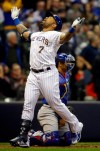 Milwaukee Brewers' Eric Thames reacts after his three-run home run against the Chicago Cubs during the third seventh of a baseball game Friday, April 5, 2019, in Milwaukee. (AP Photo/Jeffrey Phelps)