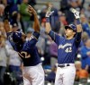 Milwaukee Brewers' Christian Yelich, right, reacts with Lorenzo Cain after hitting a three-run home run against the St. Louis Cardinals during the sixth inning of a baseball game Monday, April 15, 2019, in Milwaukee. (AP Photo/Jeffrey Phelps)