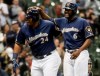 Milwaukee Brewers' Jesus Aguilar celebrates his three-run home run with Lorenzo Cain (6) during the first inning of a baseball game against the Colorado Rockies Monday, April 29, 2019, in Milwaukee. (AP Photo/Morry Gash)
