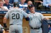 Seattle Mariners' Daniel Vogelbach is congratulated by manager Scott Servais after hitting a home run during the third inning of a baseball game against the Milwaukee Brewers Tuesday, June 25, 2019, in Milwaukee. (AP Photo/Morry Gash)