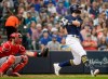 Milwaukee Brewers' Christian Yelich hits an RBI double during the third inning of a baseball game against the Cincinnati Reds Sunday, June 23, 2019, in Milwaukee. (AP Photo/Morry Gash)