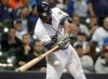 Milwaukee Brewers' Lorenzo Cain hits a three-run scoring double during the seventh inning of a baseball game against the Washington Nationals Tuesday, May 7, 2019, in Milwaukee. (AP Photo/Morry Gash)