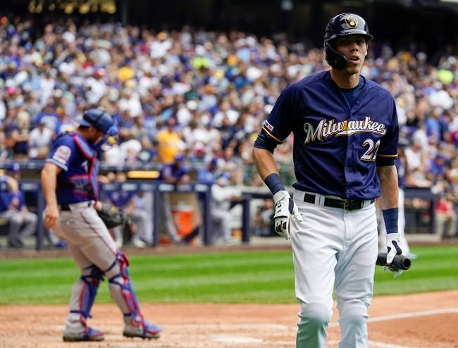 Milwaukee Brewers' Christian Yelich reacts after striking out during the eighth inning of a baseball game against the Texas Rangers Sunday, Aug. 11, 2019, in Milwaukee. (AP Photo/Morry Gash)