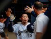 Milwaukee Brewers' Keston Hiura is congratulated after hitting a home run during the fourth inning of a baseball game against the St. Louis Cardinals Wednesday, Aug. 28, 2019, in Milwaukee. (AP Photo/Morry Gash)