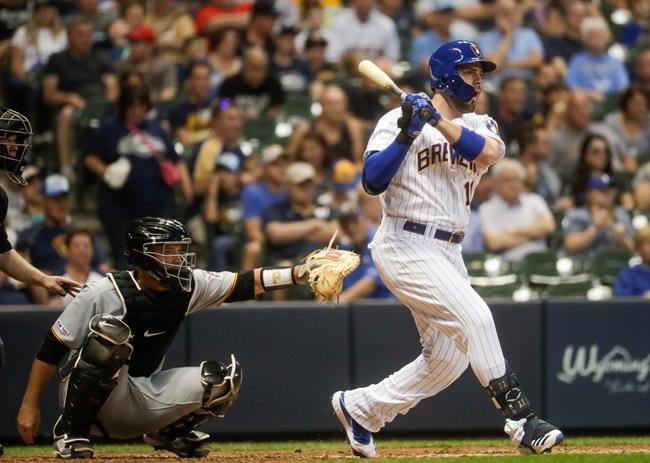 Milwaukee Brewers' Mike Moustakas hits a double during the sixth inning of a baseball game against the Pittsburgh Pirates Friday, June 28, 2019, in Milwaukee. (AP Photo/Morry Gash)