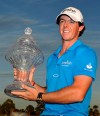 Rory McIlroy holds the trophy after winning the Honda Classic golf tournament in Palm Beach Gardens, Fla., Sunday, March 4, 2012. McIlroy became the top-ranked golfer in the world. (AP Photo/Rainier Ehrhardt)