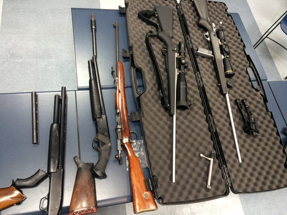 Four charged after gun stash found – Winnipeg Free Press