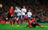 Manchester United's Paul Pogba, foreground, scores his side's first goal of the game against Bournemouth, during their English Premier League soccer match at Old Trafford in Manchester, England, Sunday Dec. 30, 2018. (Martin Rickett/PA via AP)