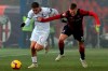 Milan's Davide Calabria, left, and Bolognas Mattias Svanberg in action during the Italian Serie A soccer match between Bologna and Milan at 