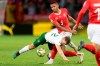 Ireland's forward James Collins, left, clashes with Switzerland's defender Manuel Akanji, top, during their Euro 2020 qualifying Group D soccer match at the Stade de Geneve, in Geneva, Switzerland, Tuesday, Oct. 15, 2019. (Laurent Gillieron/Keystone via AP)
