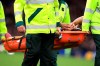 Everton's Theo Walcott is carried off after an injury during their English Premier League soccer match against Manchester City at Goodison Park in Liverpool, England, Saturday Sept. 28, 2019. (Peter Byrne/PA via AP)