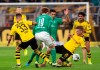 Dortmund's Julian Weigl, left, and Lukasz Piszczek, right, in action with Bremen's Josh Sargent, centre left, and Nuri Sahin, in action during their 6th round Bundesliga soccer match Borussia Dortmund against Werder Bremen at Signal Iduna Park in Dortmund, Germany, Saturday Sept. 28, 2019.(Bernd Thissen/dpa via AP)