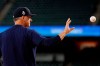 Houston Astros manager AJ Hinch catches a ball during batting practice before Game 2 of the baseball World Series against the Washington Nationals Wednesday, Oct. 23, 2019, in Houston. (AP Photo/Matt Slocum)