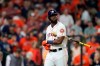 Houston Astros' Yordan Alvarez reacts after striking out with bases loaded to end the seventh inning of Game 1 of the baseball World Series against the Washington Nationals Tuesday, Oct. 22, 2019, in Houston. (AP Photo/David J. Phillip)