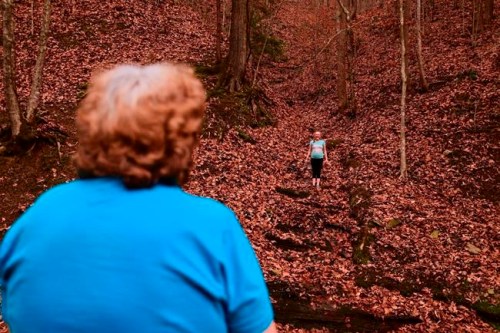 Maggie Hill, 67, watches Charity play in Madison, W.Va., on Thursday, Nov. 29, 2018. Hill adopted the 10-year-old girl about five years ago. Hill's son had been raising her but lost custody during his ongoing struggle with drug addiction, Hill said. (AP Photo/Tyler Evert)