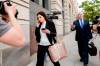 File - In this May 9, 2018 file photo, Attorneys Eric Dubelier, right, and Katherine Seikaly, left, representing Concord Management and Consulting LLC, walk out of federal court in Washington, after pleading not guilty on behalf of the company, which has been charged as part of a conspiracy to meddle in the 2016 US presidential election. A federal judge on Monday reprimanded Dubelier, saying his references to Looney Tunes and ‚ÄúAnimal House‚Äù in recent court filings are inappropriate. (AP Photo/Andrew Harnik)